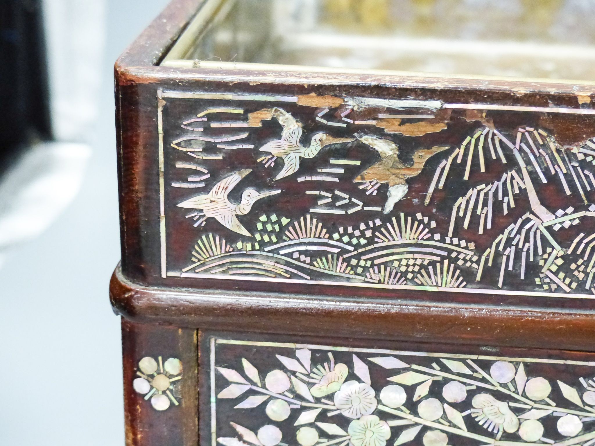 A 19th century Korean lacquered wood stove with mother of pearl inlay 38cm